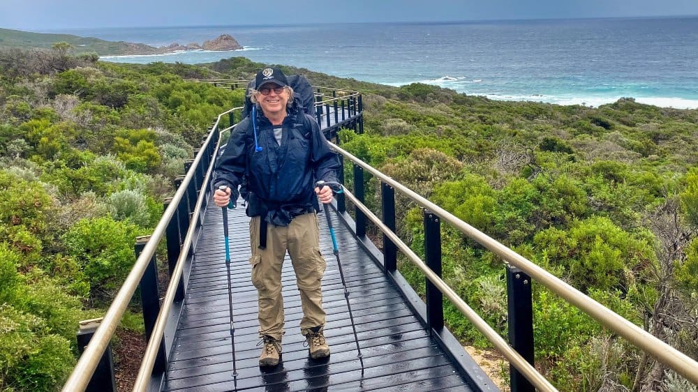 Taking Steps Towards Resilience - Man is celebrating his hiking achievement on the Bibbulmun Track with LifeTrail.