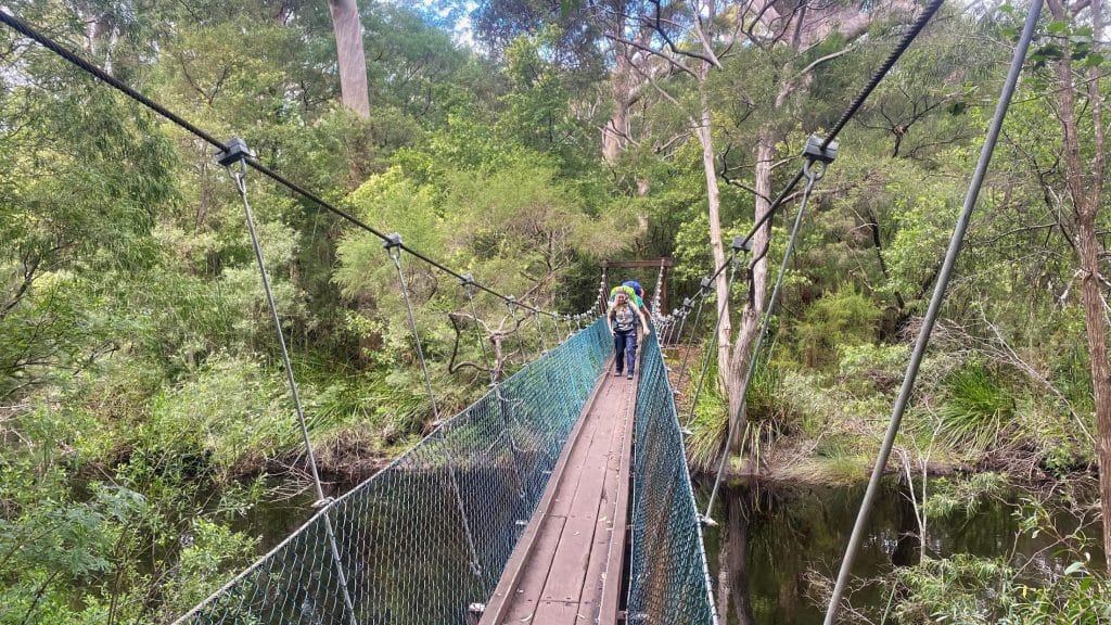 Teens crossing a bridge on the bibbulmun track
