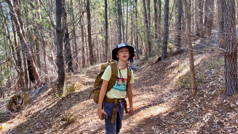 young boy hiking