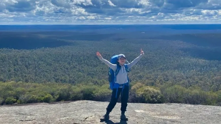 Teen girl celebrating her achievement hiking for three days With anxiety