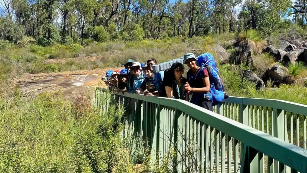 LifeTrail Teen Hikes crossing a bridge