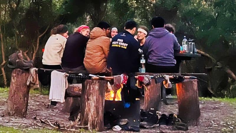 Group of teens around a campfire on the Bibbulmun Track