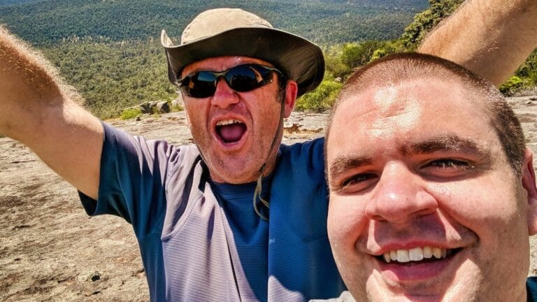 two men celebrating climb up Mt Cuthbert
