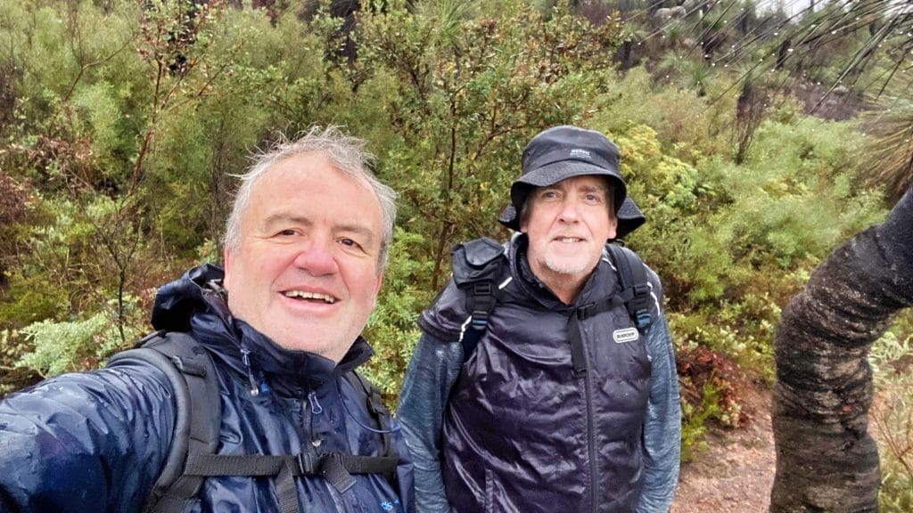 Two men day hiking in the rain