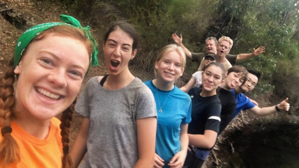 smiling teens during a hike