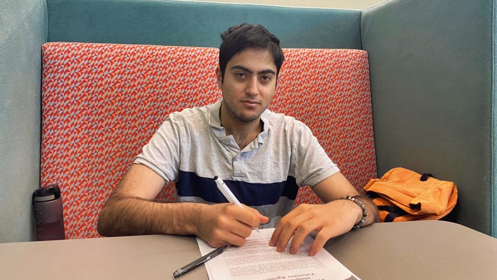 Teen boy working on paperwork on desk