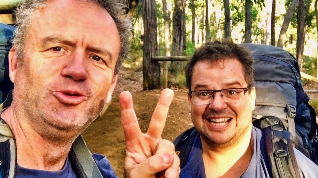 two men celebrating a multiday hike