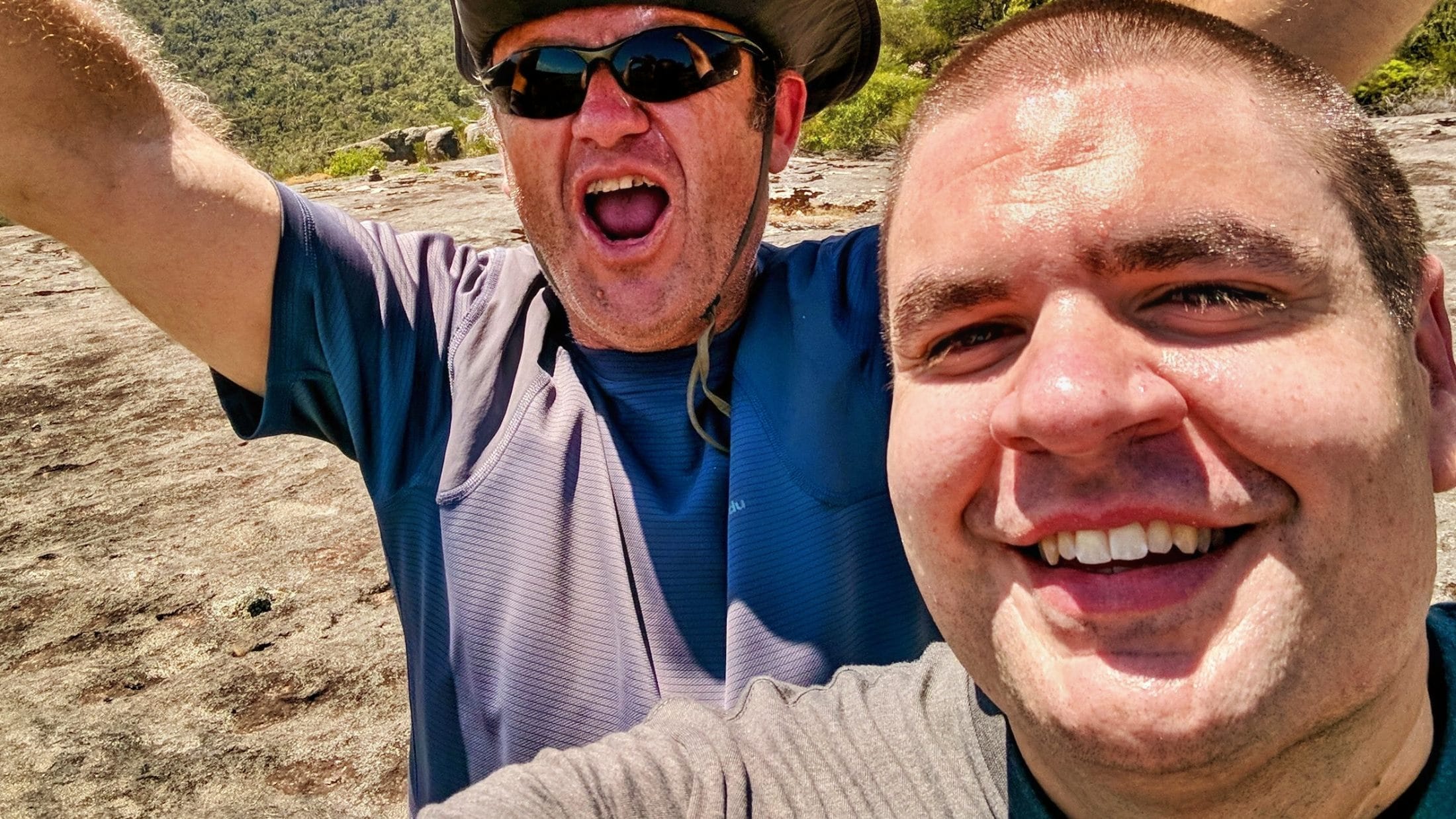 Two guys celebrating on a hike