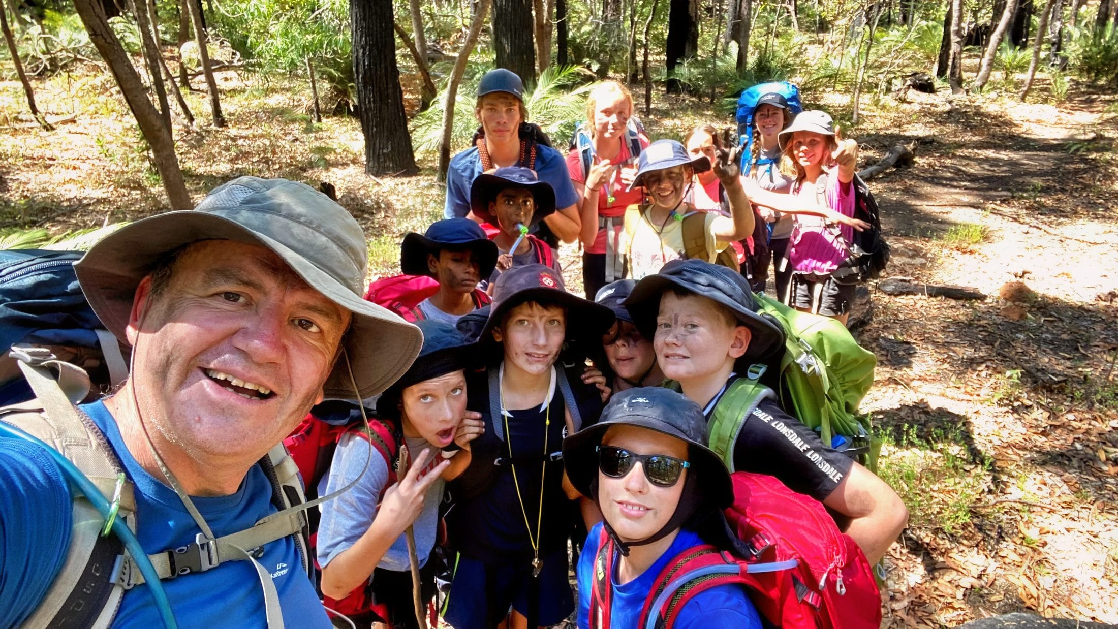 group of kids hiking photo