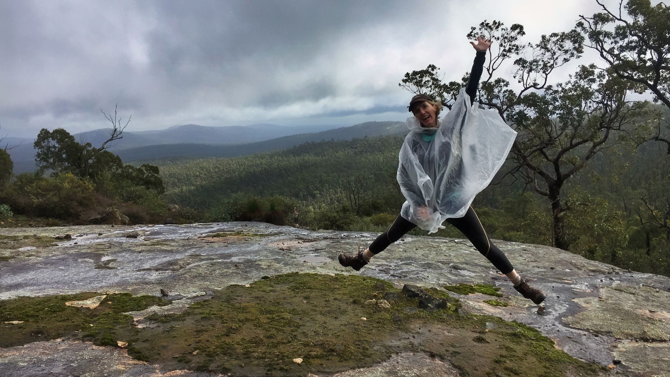 star jump while hiking in the rain
