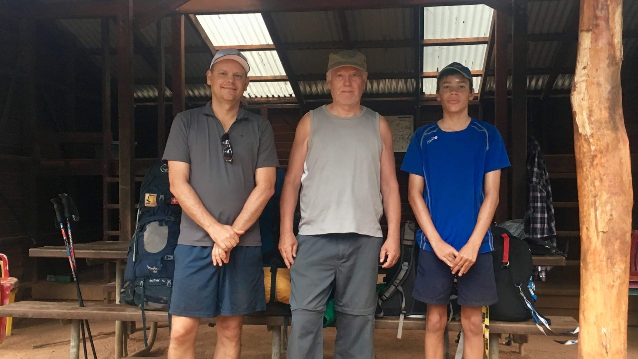 three generations of men hiking together at a bibbulmun track campsite