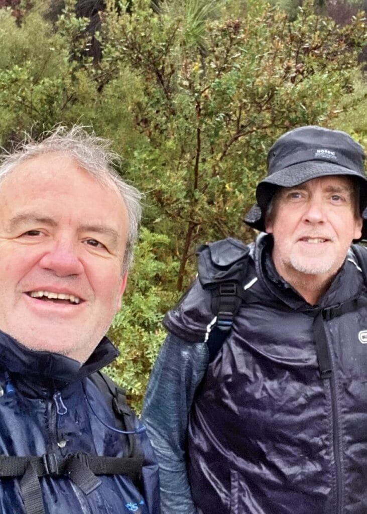 two men day hiking in the rain on the bibbulmun track